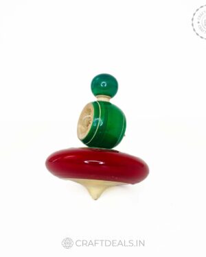 Handmade wooden spinner with vibrant colors and intricate design, a perfect blend of tradition and fun from Channapatna
