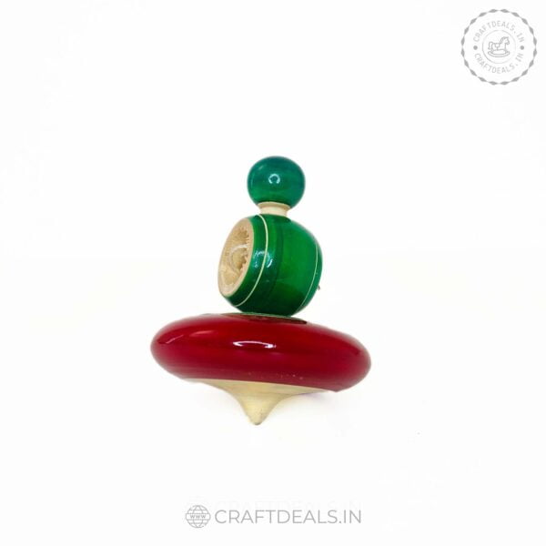 Handmade wooden spinner with vibrant colors and intricate design, a perfect blend of tradition and fun from Channapatna