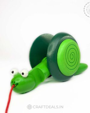 Wooden Snail Pull Along Toy - Eco-friendly, handcrafted Channapatna toy with a whimsical design, perfect for imaginative play and skill development.